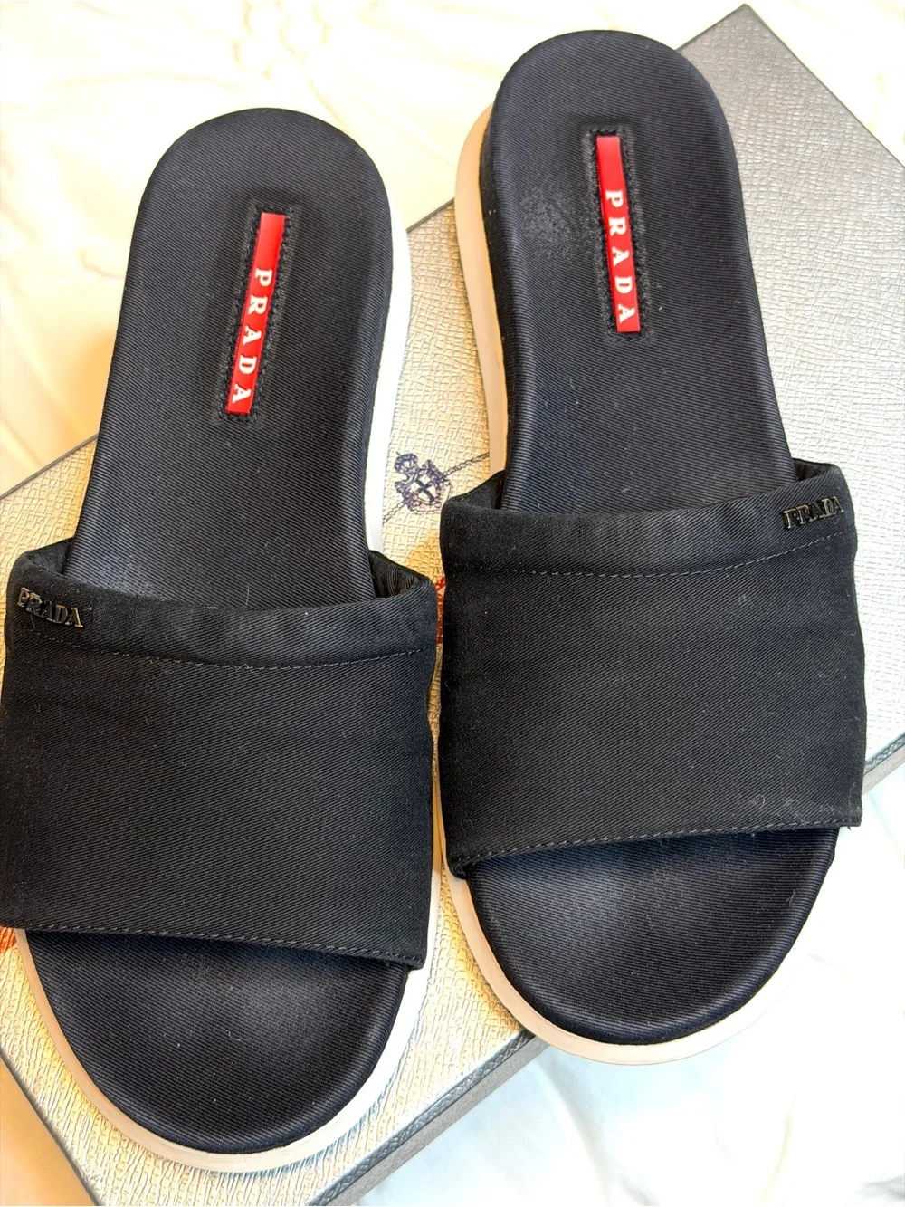 Prada Black Slides with White Soles and Red Logo Tag - Picture 1 of 3